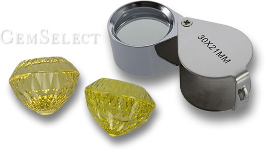 Inspecting Gemstones With a Jeweler's Loupe