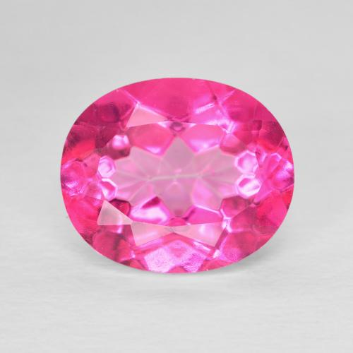 Precious topaz. Oval. Lite shops pink. .97ct 7.6x5.3mm. Faceted gemstone.