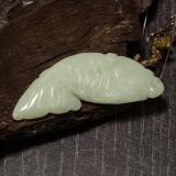 thumb image of 28.1ct Carved Fish with Hole Grayish Green Jadeite (ID: 484956)
